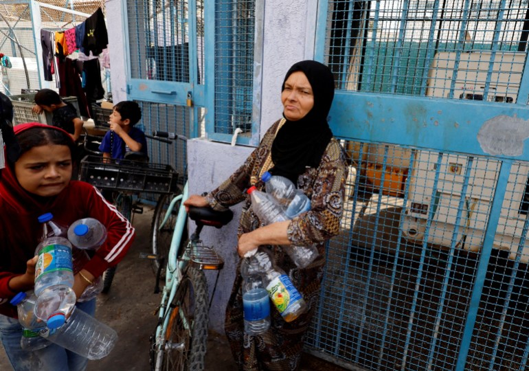 Palestinians who have fled their homes due to Israeli strikes, take shelter in a UN-run school in Khan Younis