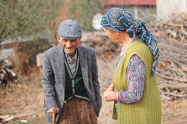 Aziz Gundogdu in the backyard of his house in the village of Doganca, with his daughter Necmiye Demirel, 75. At 102, Gundogdu is older than the Turkish Republic itself.