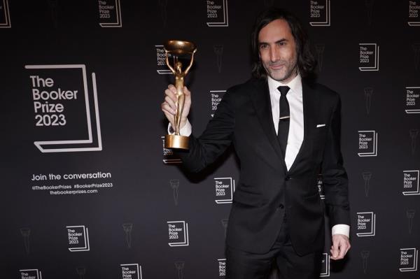 Paul Lynch, Winner of the 2023 Booker Prize poses for the media with his trophy. — Photo: AP