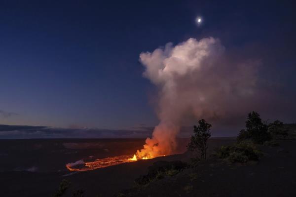 In this photo provided by the Natio<em></em>nal Park Service, lava spews from the Kilauea volcano in Hawaii in June. it is one of two volcanoes whose names that made this year's lists of the most mispro<em></em>nounced words in the U.S. and Britain. — Photo: AP