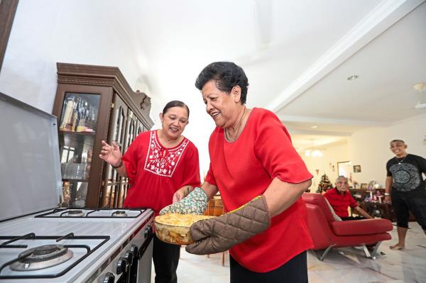 Hendroff (right) is grateful her eldest daughter Annalee (left) has learned how to make her family's signature chicken pot pie.