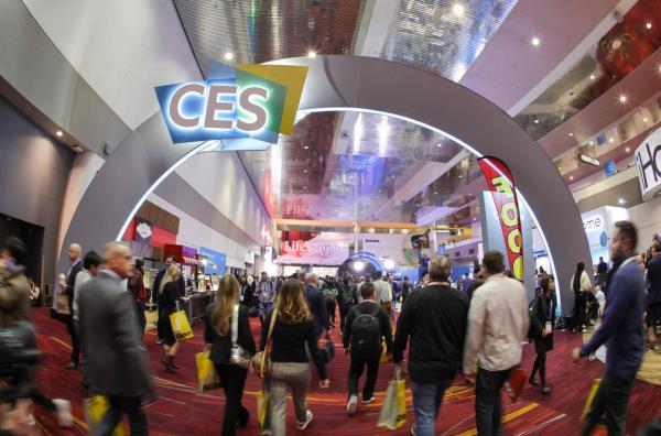 Attendees walk under a CES sign during CES 2024 at the Las Vegas Convention Center on Jan 10, 2024 in Las Vegas, Nevada. — AFP