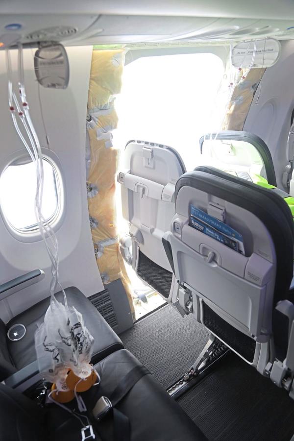 An image released by the (US) Natio<em></em>nal Transportation Safety Board showing a section of Alaska Airlines Flight 1282 that is missing panel on a Boeing 737-9 MAX plane. — NTSB/AP