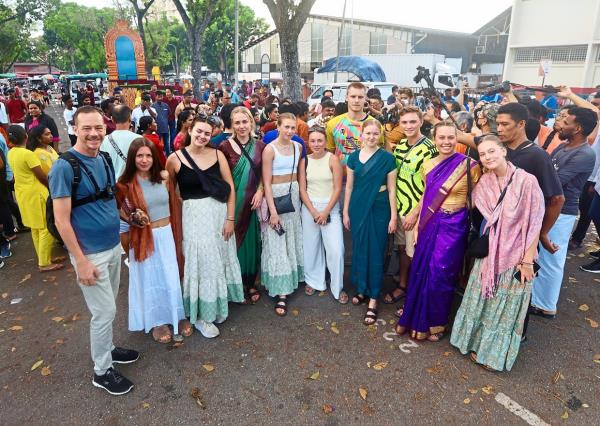 Sacred ceremony: Ventrivel and Kathirvell carrying a kavadi during the celebration along Jalan Kebun Bunga in George Town. (Inset) Prof Frestad (left) posing for a picture with his students. — ZHAFARAN NASIB/The Star
