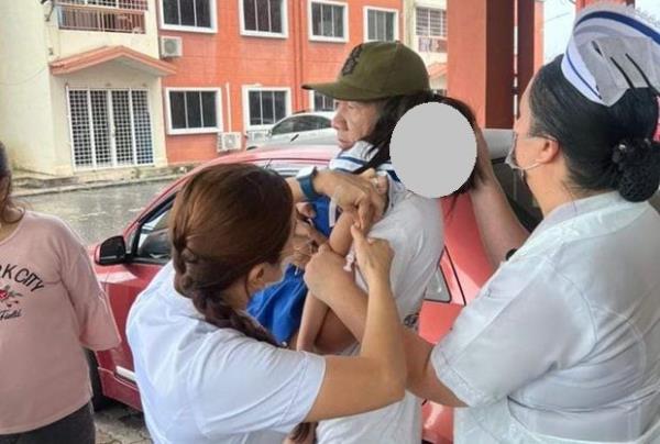 Nurses vaccinating a child. 