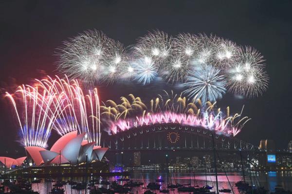 Fireworks erupt over Sydney’s ico<em></em>nic Harbour Bridge and Opera House during a fireworks display to usher in the new year.