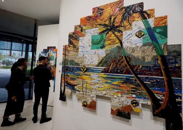 Nor Tijan revisited a childhood dream to create a beach scene in 'The Price Of Progress', with a contemporary spin on beach pollution. Photo: The Star/Azlina Abdullah 