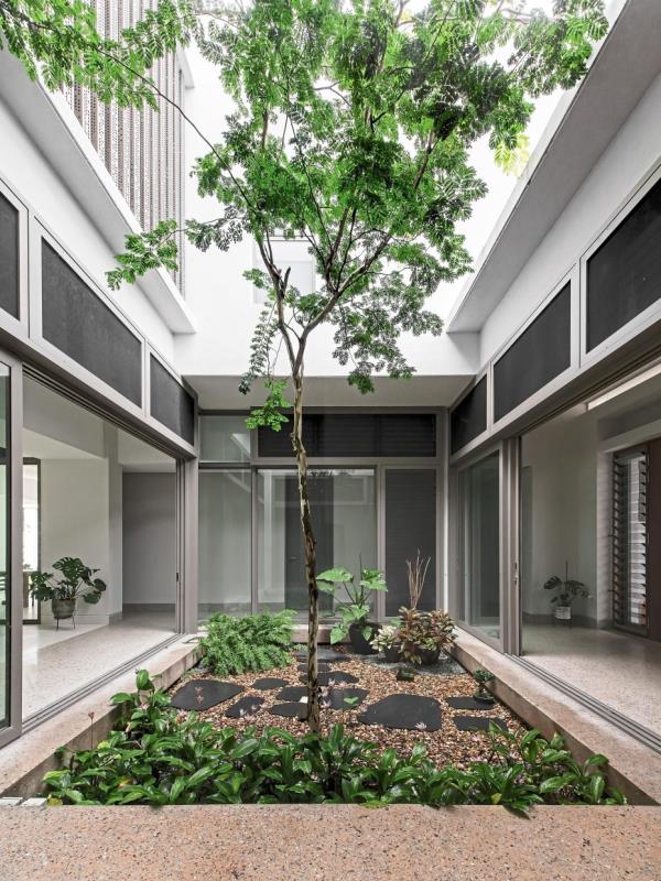 The inner courtyard at Light Box house provides a seamless transition between indoor and outdoor spaces.