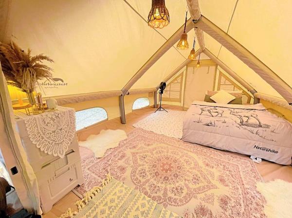 Note the inflatable framework of this air tent, which is large enough for eymma and rahim to fit four queen-size air beds inside.
