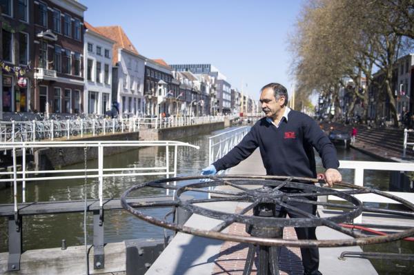 In an undated photo, Rashid Ouchene, one of five lock operators employed by the city of Utrecht, the Netherlands. The button helps a<em></em>lert a worker in the Dutch city of Utrecht to crank open a dam, allowing the fish to wriggle toward shallower water wher<em></em>e it can spawn. — Mark van Heukelum via The New York Times