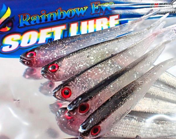 Soft plastic lures for threading a hook through with tinsel bits in their bodies that glitter like real fish scales.