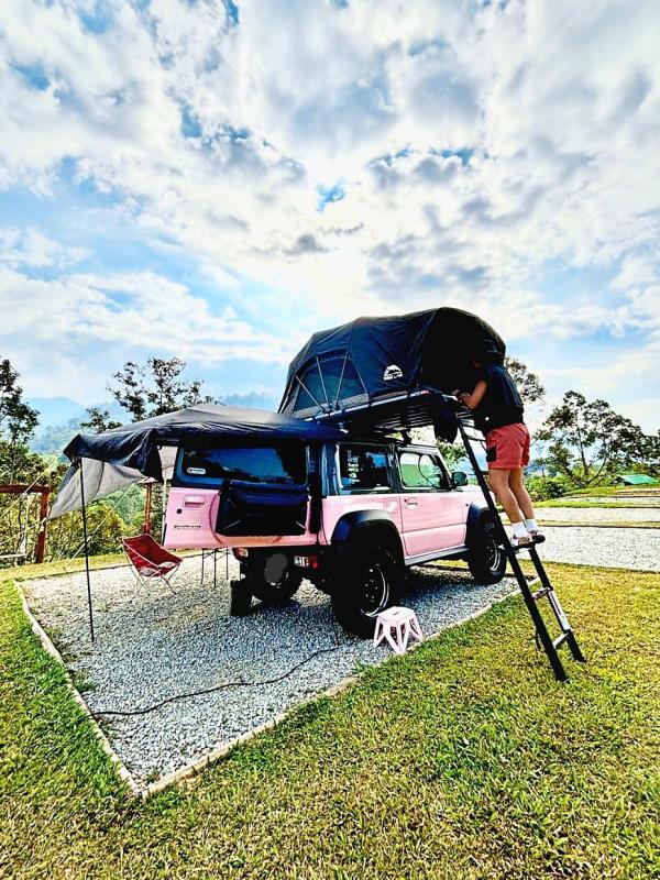 Chow likes camping with a car-roof tent.
