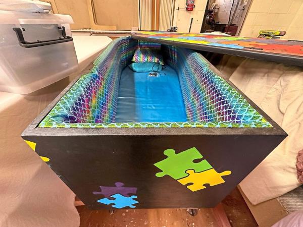 A jigsaw-themed coffin is among the DIY caskets made at the Coffin Club’s workshop in Hastings, New Zealand. — AFP