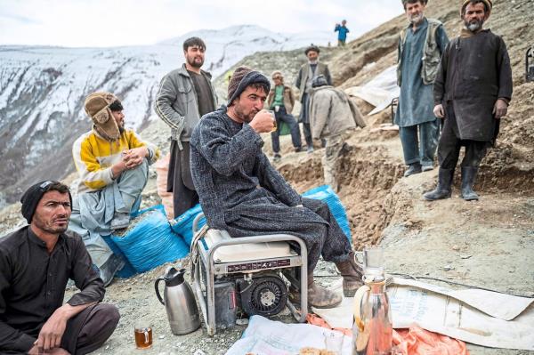 Afghan miners taking a break outside a gold mine in the mountains of Yaftal Sufla district in Badakhshan province. — AFP