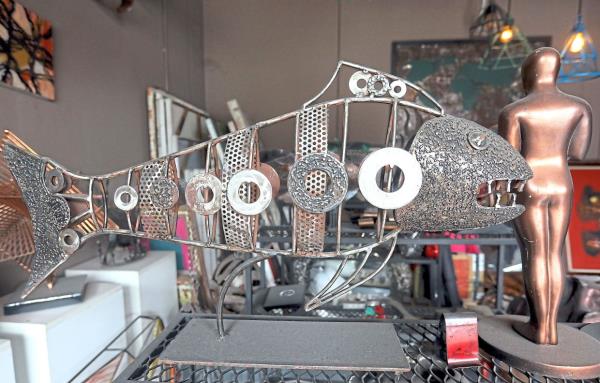 Nizam's whimsical fish sculpture highlights the beauty and creativity of sustainable art.