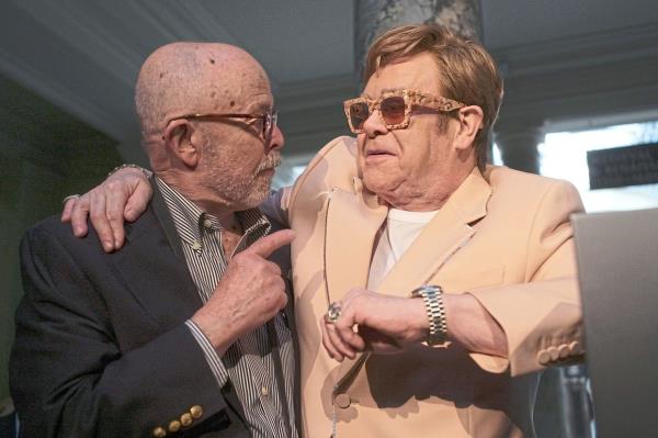 Photographer Richard Drew is greeted by Elton John at the opening of a new exhibition of photographs owned by John at London’s Victoria and Albert Museum last week. Photo: AP