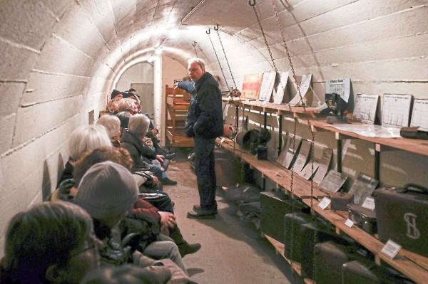Wulf speaking to a group of visitors to the Hamburg Bunker Museum. The tubular bunker from World War II has been a museum since 1997. — Photos: CHRISTIAN CHARISIUS/dpa