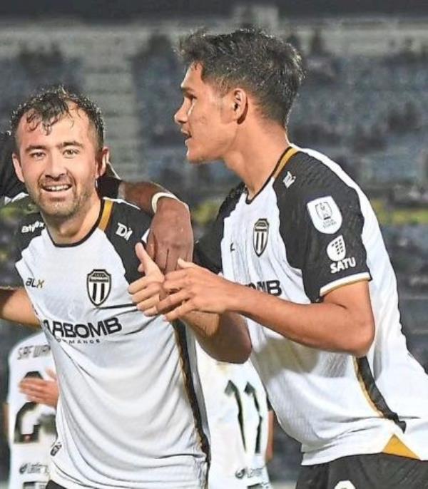 Steady presence in midfield: Terengganu’s Nurillo Tukhtasinov (left) celebrating with Ubaidullah Samsul Fazili after scoring against Kelantan in a Super League match. —Terengganu FC