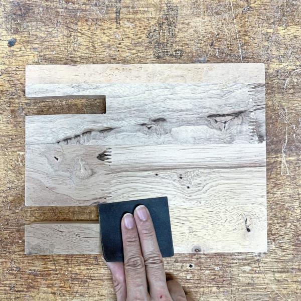 Smooth it out! Grab some 320-grit sandpaper and give all the edges and surfaces a good sanding. This will make sure there are no rough spots and give your docking station a sleek, polished look.