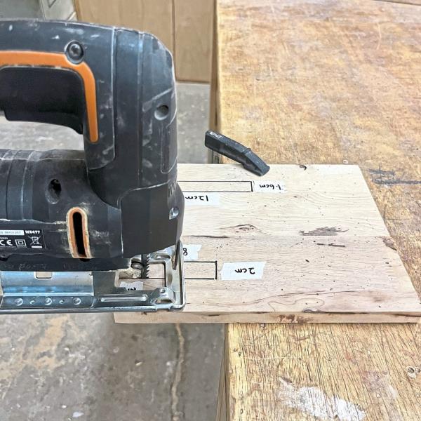 Now, let’s cut it out! Using a jigsaw, carefully cut along the marked lines. Remember to wear safety goggles and a mask to keep safe from dust and debris.