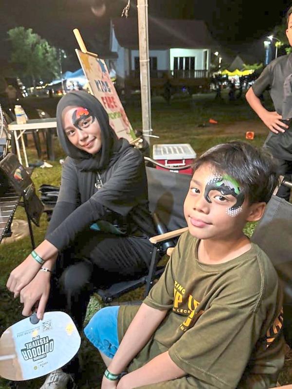 When night falls, participants get to try face-painting.