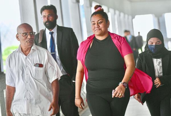 Shalini Periasamy leaving Kuala Lumpur Court Complex after being charged over a cyberbullying case. - FAIHAN GHANI/The Star
