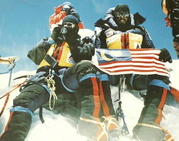 N. Mohanadas (holding a camera) and M. Magendran created history when they set foot on the the summit of Mt Everest in 1997.