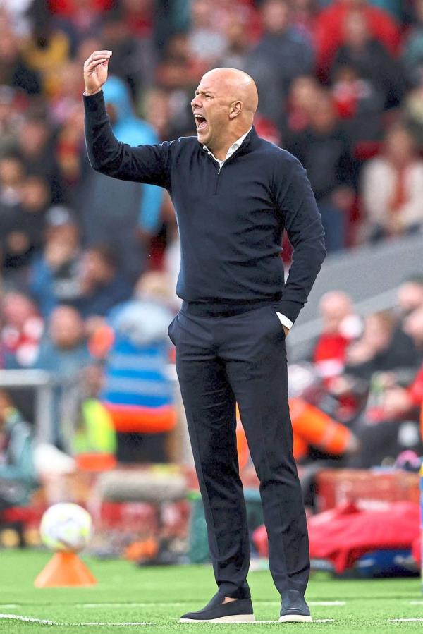 Liverpool's Dutch manager Arne Slot shouts instructions to the players from the touchline during the English Premier League football match between Liverpool and Brentford at Anfield in Liverpool, north west England on August 25, 2024. (Photo by Darren Staples / AFP) / RESTRICTED TO EDITORIAL USE. No use with unauthorized audio, video, data, fixture lists, club/league logos or 'live' services. online in-match use limited to 120 images. An additional 40 images may be used in extra time. No video emulation. Social media in-match use limited to 120 images. An additional 40 images may be used in extra time. No use in betting publications, games or single club/league/player publications. / 