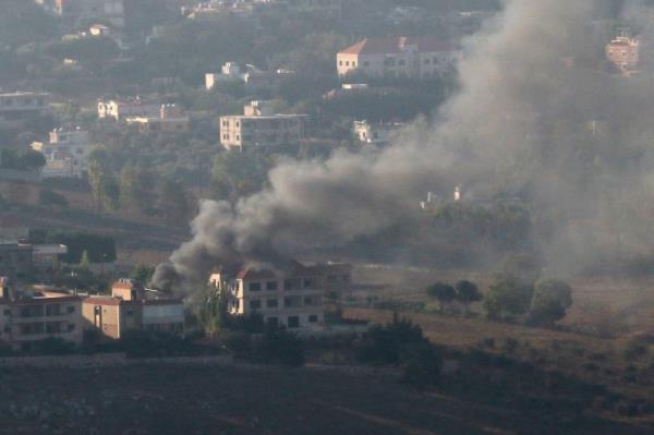 A view shows smoke and fire on the Lebanese side of the border after Israel's attacks