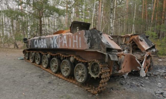 ‘Glory to Ukraine’ daubed on a burned-out Russian armoured vehicle in Chernobyl in April 2022.
