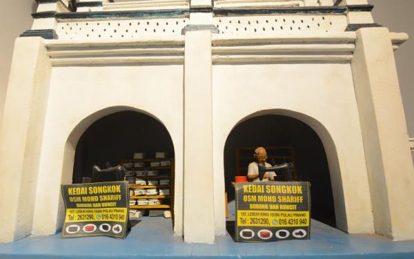 Low's miniature of Haja Mohideen, the current owner of Kedai So<em></em>ngkok OSM Mohd Shariff, which is located in an alcove next to the Nagore Shrine. The business was established by Haja Mohideen's father in 1933 and is the last of its kind in George Town. Photo: K.T. GOH/The Star