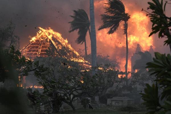 FILE - The hall of historic Waiola Church in Lahaina and nearby Lahaina Ho<em></em>ngwanji Mission are engulfed in flames along Wainee Street on Aug. 8, 2023, in Lahaina, Hawaii. (Matthew Thayer/The Maui News via AP, File)