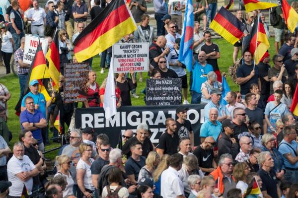 Supporters of the far-right Alternative for Germany (AfD) party gather originally for a campaign event for the European elections a week after the murder of a police officer by an Afghan immigrant