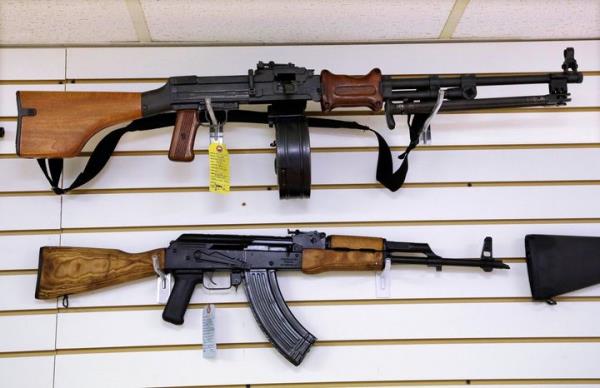 Assault-style weapons are displayed for sale at Capitol City Arms Supply, Jan. 16, 2013, in Springfield, Ill. 