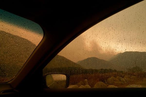 Smoke is seen from the advancing Line Fire through a car window in Mentone, Calif., on Sept. 8, 2024.