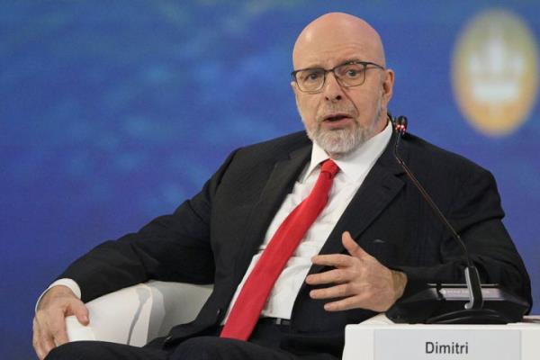 In this image provided by Agency RIA Novosti, Dimitri Simes, author, editor and political analyst, asks Russian President Vladimir Putin a question during a session of the Internatio<em></em>nal Eco<em></em>nomic Forum in St. Petersburg, Russia, on June 16, 2023.