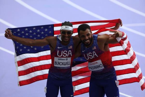 Jaydin Blackwell of the U.S., left, celebrates a new world record time of 10.64 with teammate and silver medalist Ryan Medrano in the men's 100-meter T38 race at the Paralympic Games in Paris. 