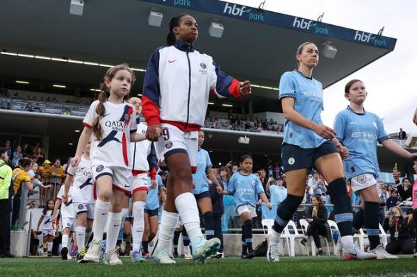 PERTH, AUSTRALIA - SEPTEMBER 01: Marie-Antoinette Katoto of PSG and Alanna Kennedy of Manchester City walk out o<em></em>nto the pitch during the Perth Internatio<em></em>nal Football Cup Final between Manchester City and Paris Saint-Germain at HBF Park on September 01, 2024 in Perth, Australia. (Photo by Paul Kane/Getty Images)