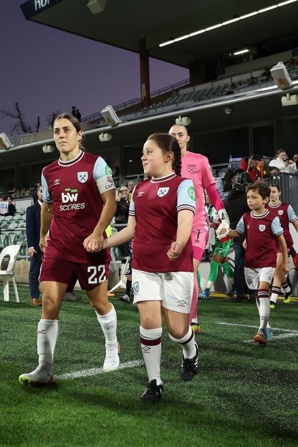 PERTH, AUSTRALIA - AUGUST 29: Katrina Gorry of West Ham United leads the team out o<em></em>nto the field during the Perth Internatio<em></em>nal Football Cup match between West Ham United and Paris Saint-Germain at HBF Park on August 29, 2024 in Perth, Australia. (Photo by Paul Kane/Getty Images)