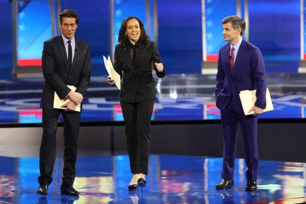 ABC network anchors and debate moderators David Muir, Linsey Davis and George Stephanopoulos speak on stage prior to the Democratic presidential primary debate in the Sullivan Arena at St. Anselm College on February 07, 2020 in Manchester, New Hampshire.