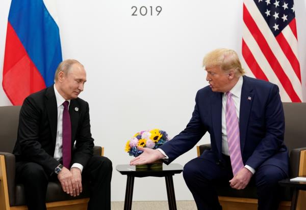 Then U.S. President Do<em></em>nald Trump and Russia’s President Vladimir Putin at the G20 leaders summit in 2019