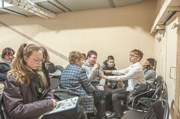 Children sheltering at their school in Kyiv during an air raid a<em></em>lert. — ?2024 The New York Times Company
