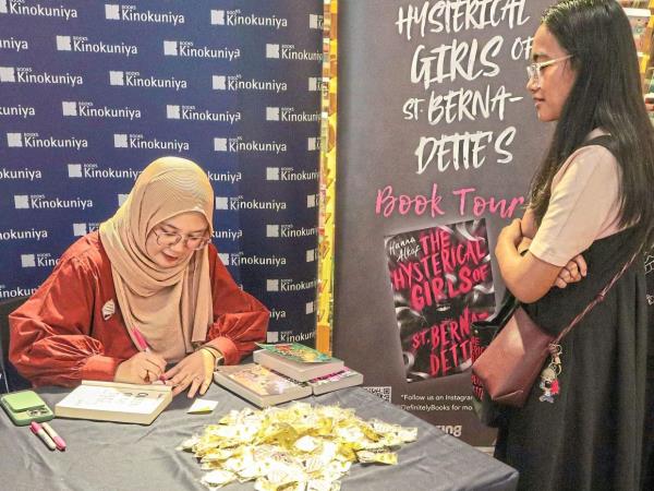 Hanna is on a busy book tour across the Klang Valley this month, bringing 'The Hysterical Girls Of St Bernadette’s' to eager readers. Photo: Books Kinokuniya