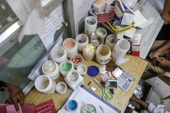 A table covered with pots of medicine