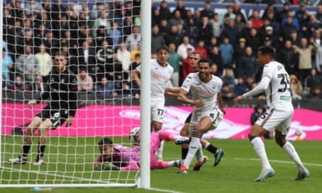 Ben Cabango, second right, puts Swansea ahead in the clash with Bristol City