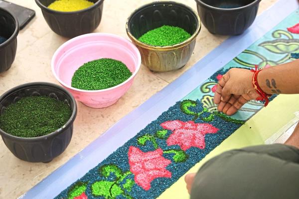 Kolams are created to welcome guests and symbolise prosperity, harmony and positive energy. Photo: The Star/Azman Ghani
