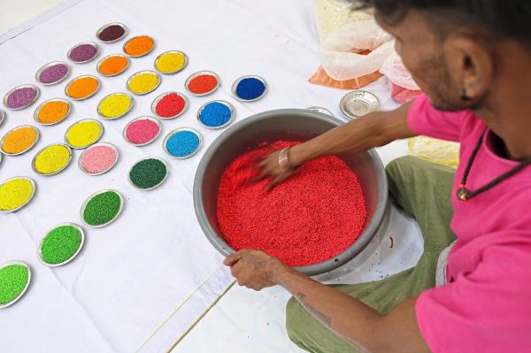 Vibrant hues of the kolam come to life through a careful dyeing process.