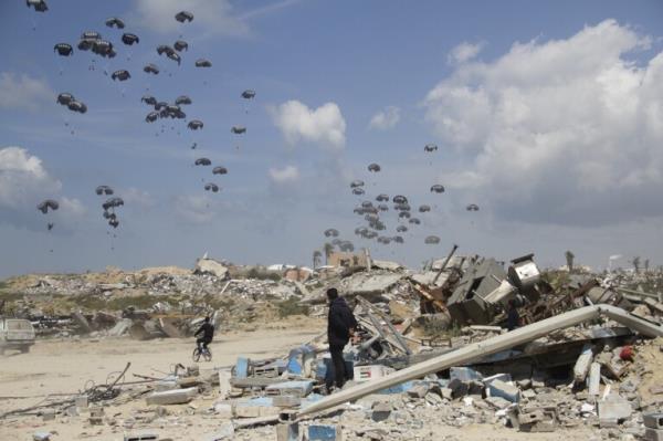 FILE - Humanitarian aid is airdro<em></em>pped to Palestinians over Gaza City, Gaza Strip, Monday, March 25, 2024. (AP Photo/Mahmoud Essa, File)