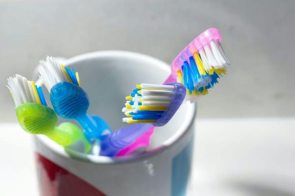 Toothbrushes in a toothbrush holder.