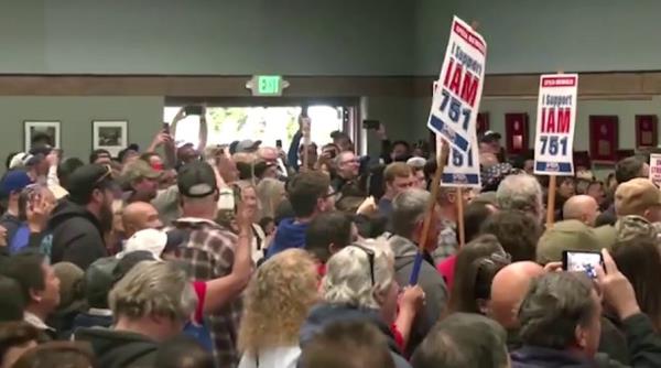 Striking workers boo after Dem senator criticizes Trump at rally